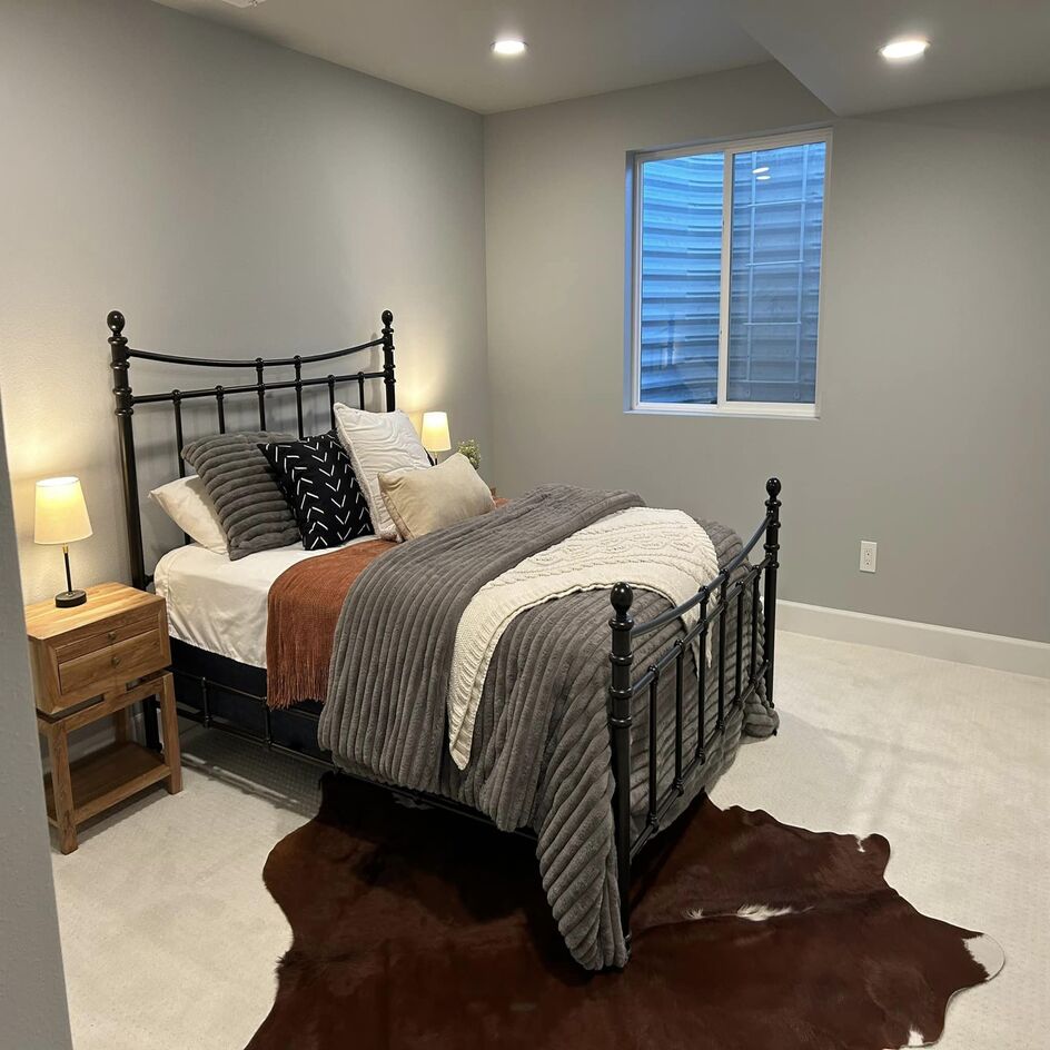 Finished basement bedroom with an egress window in Northern Colorado by Blue Springs Construction